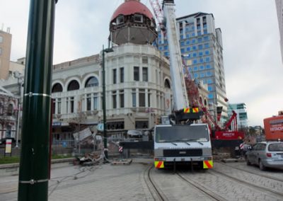 Crane and excavator at the Regent Buildings in Cathedral Square, seen across the tram tracks