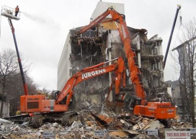 Jurgens excavators and an elevated work platform working on the damaged Scales House facade