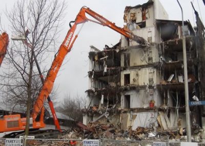 Jurgens high reach excavator and elevated work platform beside the damaged Scales House on Cashel Street